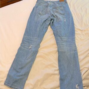 American Eagle High-Waisted Distressed blue jeans.